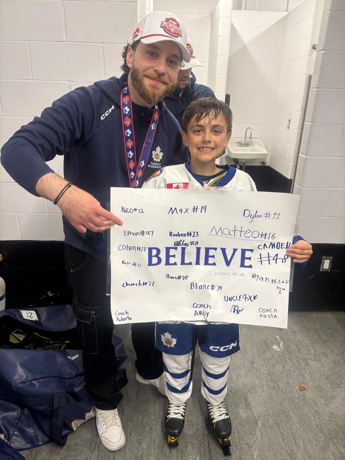 Michael and a young athlete after a GTHL championship win