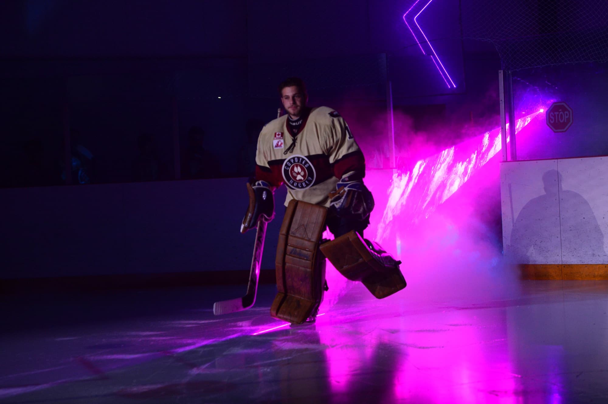 Michael skating onto the ice as a professional goalkeeper